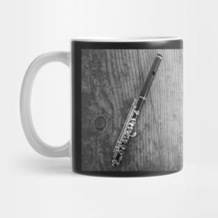 Top down view of wooden flute on wooden table Mug